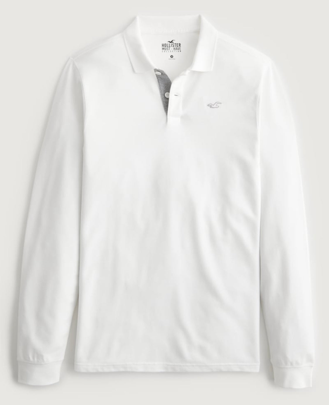 Polo à emblème avec manches longues