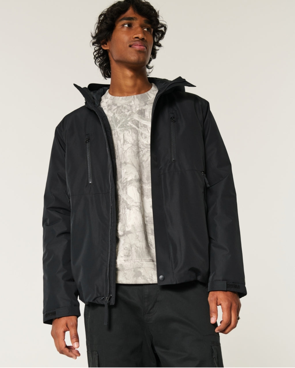 Veste coquille à capuchon